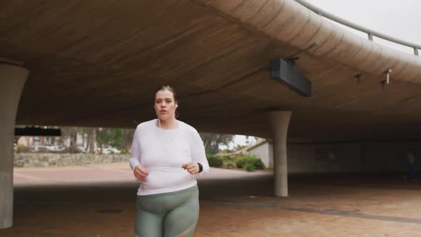 Young Caucasian woman running