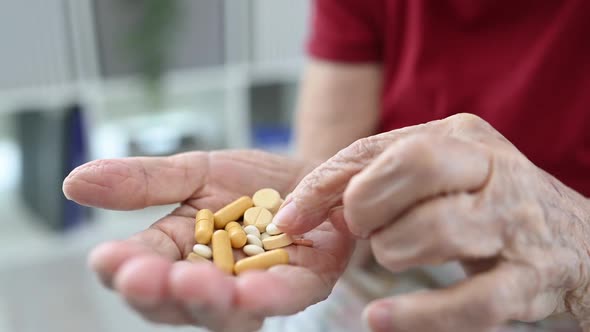 Senior Woman Taking Medicine