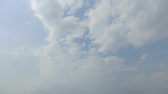 Time lapse of white cloud moving pass around sky background