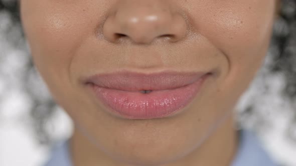 Lips and Teeth of Smiling Young African Woman