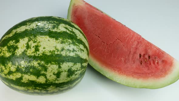 Watermelon And A Delicious Slice On White Surface