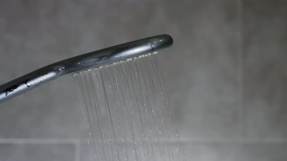 Turning On The Shower, The Flow Of Water From The Shower Head In The Bathroom.