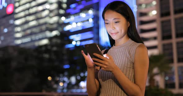 Young Woman Use of Cellphone in Hong Kong