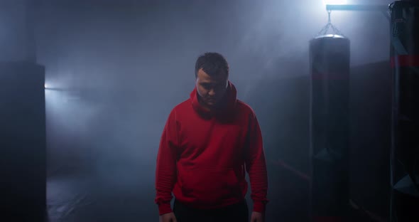 Portrait Boxer Takes Off the Hood From His Head Serious Expression Before the Fight