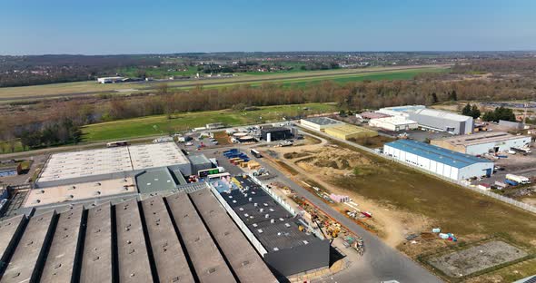 Aerial View of Goods Warehouses and Logistics Center in Industrial City Zone From Above