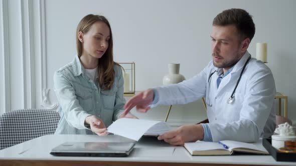 Man Professional Doctor Showing Medical Test Result