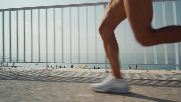 Female Runner Feet Running on Promenade