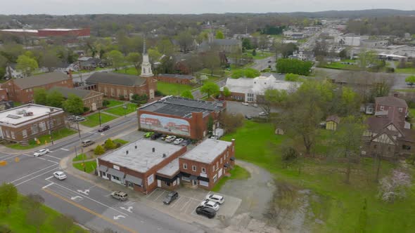 Pan over intersection in Thomasville, North Carolina with a church, train tracks and crossing and do