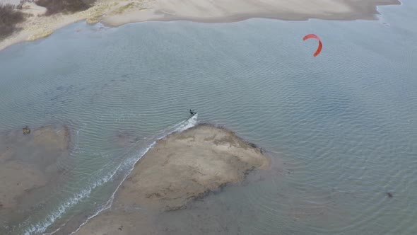 Arial view of a person doing windsurf in Retranchement, Netherlands.