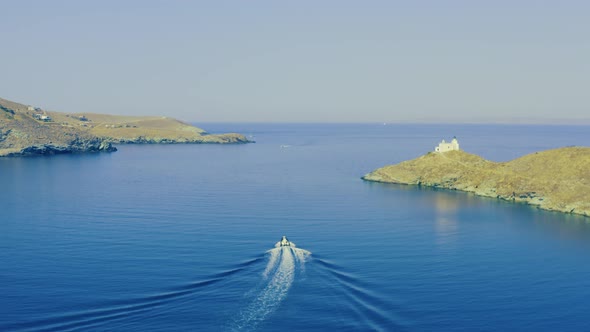 Motorboat and white wake on calm sea