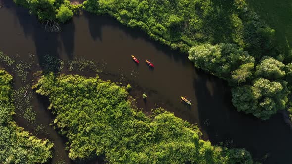 Top View of the Svisloch River Kayakers Floating on the River in the City's Loshitsky Park at Sunset