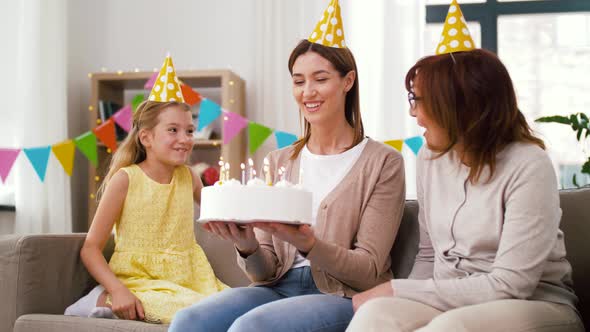 Mother, Daughter, Grandmother with Birthday Cake