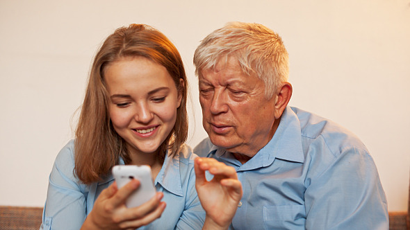 Young Girl and Old Person Learn Smartphone alt