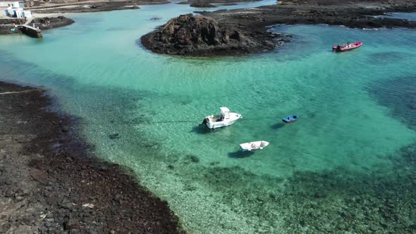sensational crystal clear waters with floating boats shot with drone in 4k