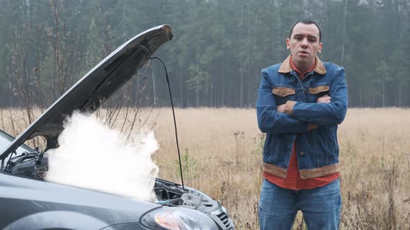 Young Stressed Man Having Trouble with His Broken Car