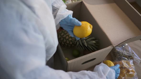 Volunteer in Protective Suits Pack Products.