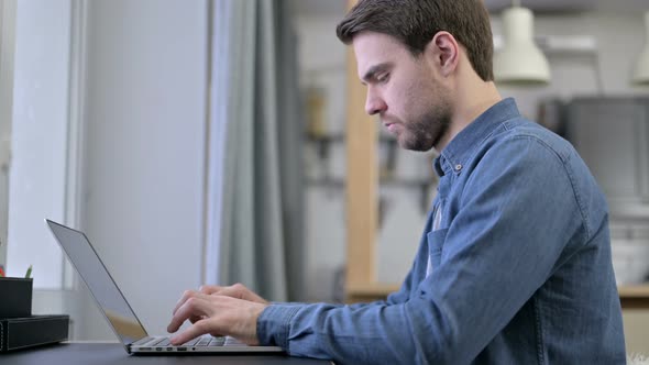 Ambitious Beard Young Man Working on Laptop