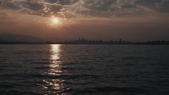 Sunrise over Ocean and Vancouver Skyline, wide static shot