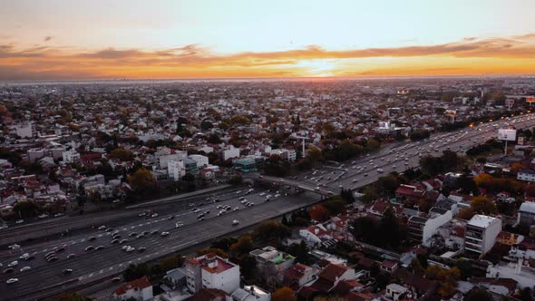 Aerial hyperlapse of traffic on highway in Buenos Aires at sunset