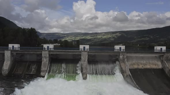 Drone Shot Of Man On Bridge Of Hydroelectric Dam