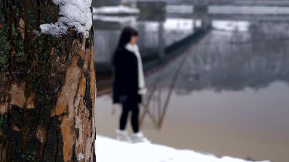 Beautiful Woman With Sad Emotion Walks On River Bank Thinking. Winter Slow Motion 4