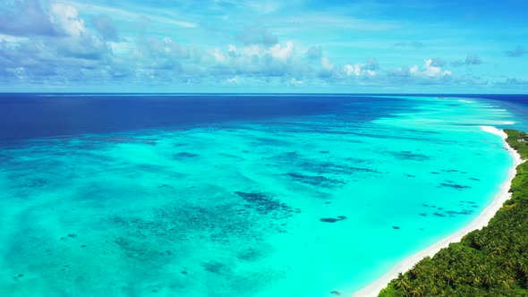 Tropical drone clean view of a white sand paradise beach and blue ocean background in 4K