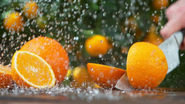 Super Slow Motion Shot of Orange Chopped with a Knife at 1000 Fps.