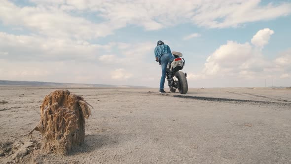 Motorcyclist Doing Tire Burnout in the Desert Slow Motion