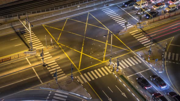 Aerial View of a Road Intersection in a Big City Night Timelapse