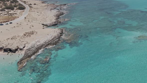 Rocky coastline of Falasarna beach in Crete island, aerial view