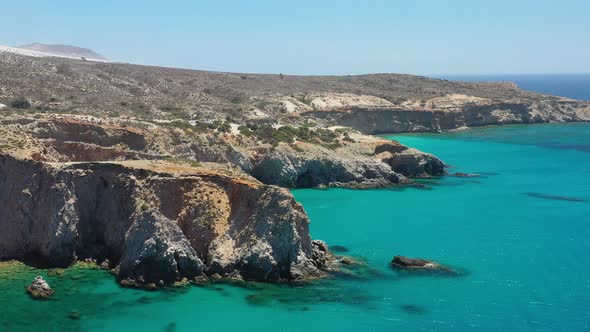 Aerial seascape at the day time. Bay and rocks. Blue water background in the summer.