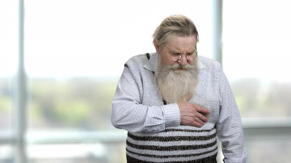 Old Man in Sweater Suffering From Sudden Stroke