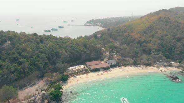 Upper View Ocean Yellow Sand Beach with Brown Building Roofs