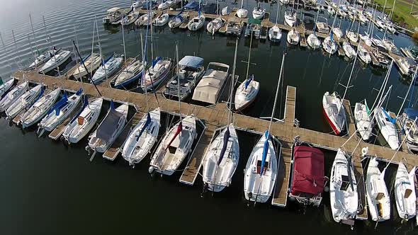 Aerial footage of sailboat marina.