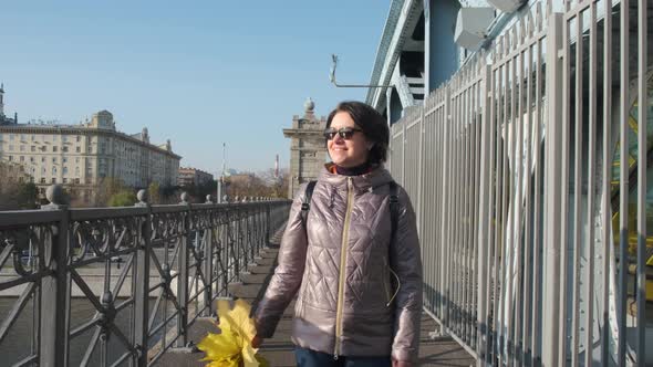 Portrait of Pretty Woman Walking on City Street