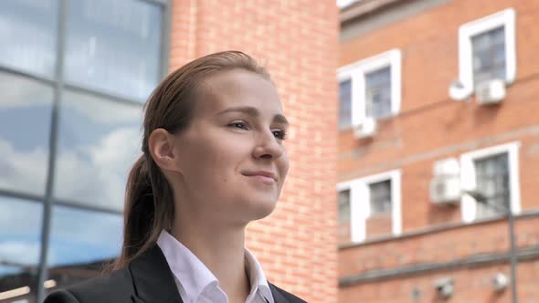 Female Employee Walking Ouside Office