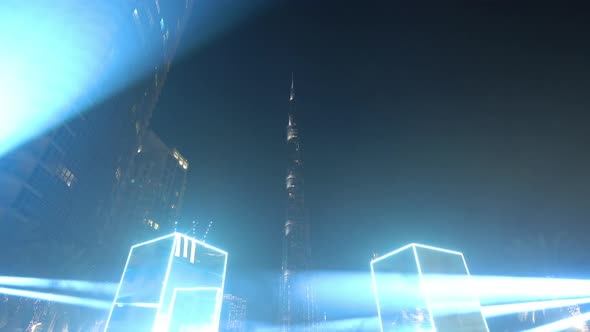 Spinning mirror and light show at Burj plaza. Burj Khalifa in Dubai Downtown skyline,