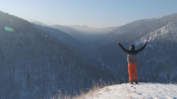 A Man on Top of a Mountain