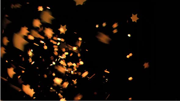 Orange stars moving against black background