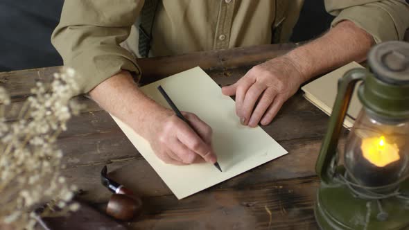 Unrecognizable Senior Man Writing Handwritten Letter