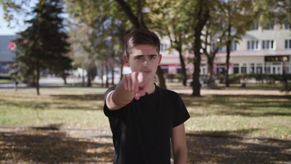 Young Man Suspicious Look I Am Watching You Gesture on White Background