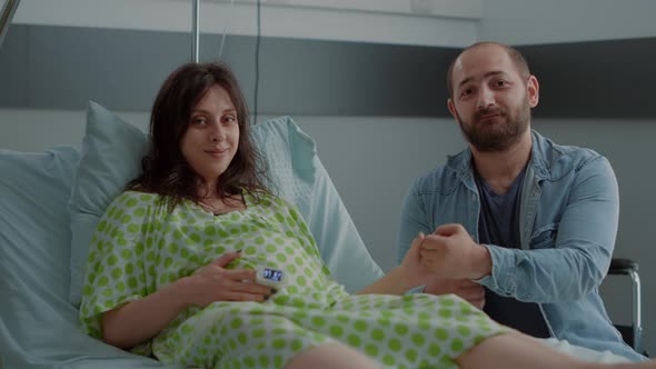 Happy Family Preparing for Childbirth in Hospital Ward