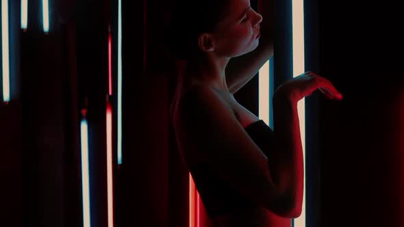 Sensual Woman Under Neon Illumination