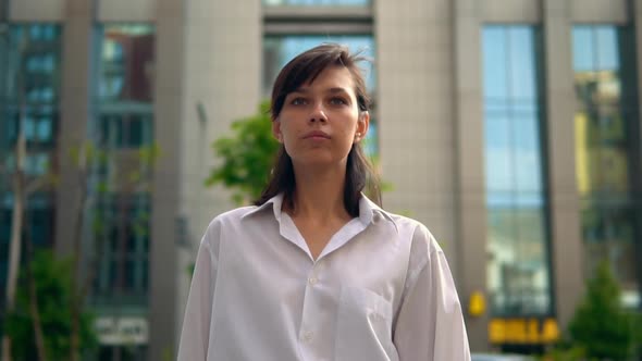 Portrait Young Woman in Elegant White Shirt Walking on the Street