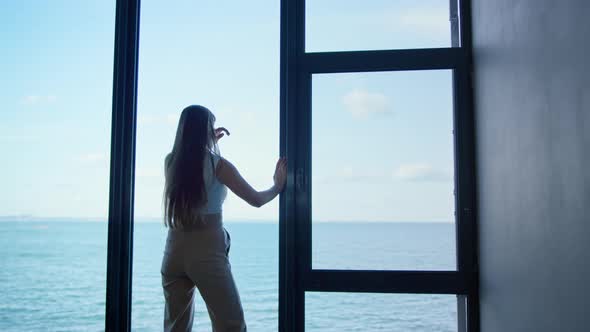 Lonely Woman Thinking Problems at Panorama Window