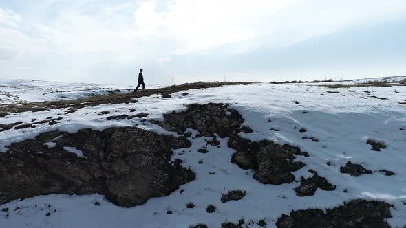 Young Student Walking Snow Mountain