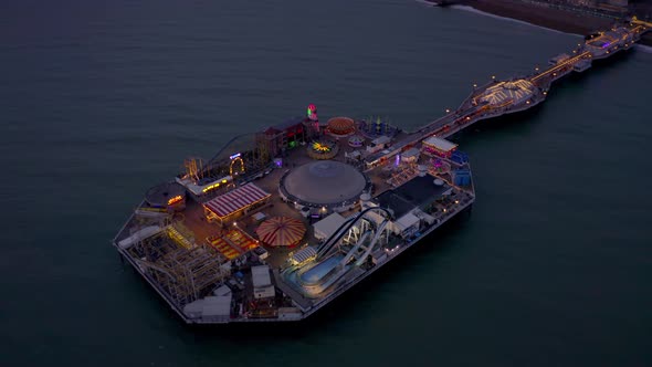 Brighton Seafront Pier Illuminated at Night Aerial View