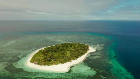 Tropical Island with Sandy Beach. Mantigue Island, Philippines