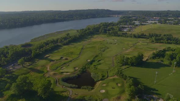 Aerial of a Golf Course by the Water on a Sunny Day in Long Island
