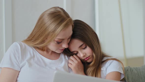 Adult Mother and Daughter Teenager Sitting on Couch with Laptop Woman Working Online in Network Girl